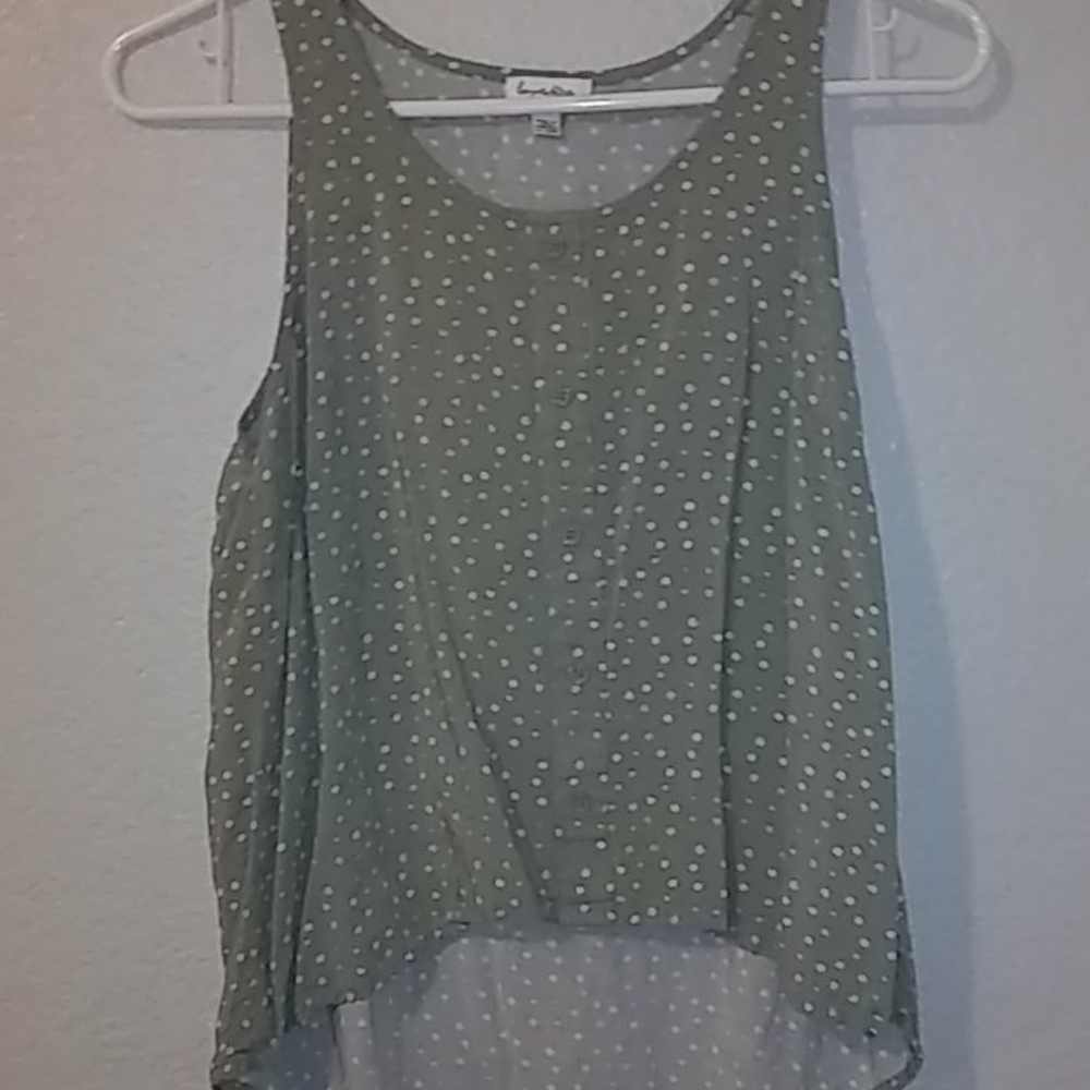 Green shirt with white polka dots